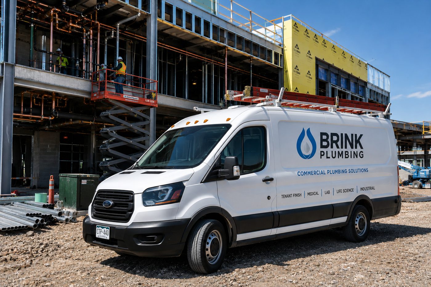 Brink Plumbing van on a commercial jobsite in Colorado